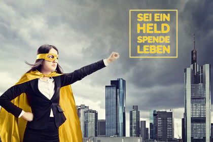 Female superhero standing in front of a city